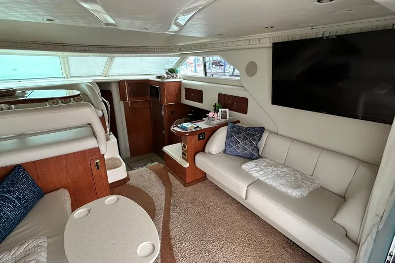 Slide: The Image of Luxurious interior of a 1999 Sea Ray 400 Sedan Bridge yacht with plush seating and modern amenities. - 25