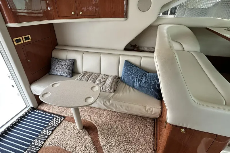 Slide: The Image of Luxurious interior of 1999 Sea Ray 400 Sedan Bridge yacht with plush seating and elegant decor. - 27