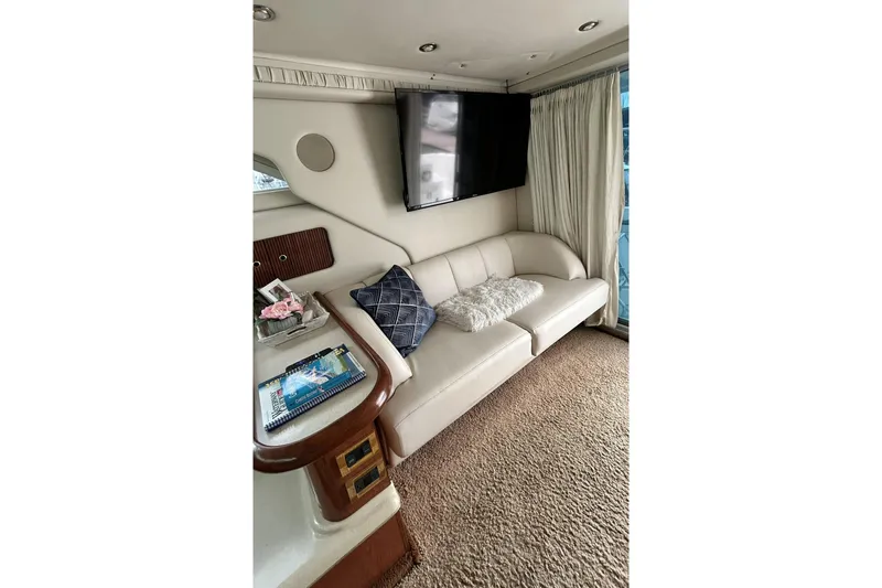 Slide: The Image of Luxurious interior of 1999 Sea Ray 400 Sedan Bridge with plush seating and modern decor. - 28