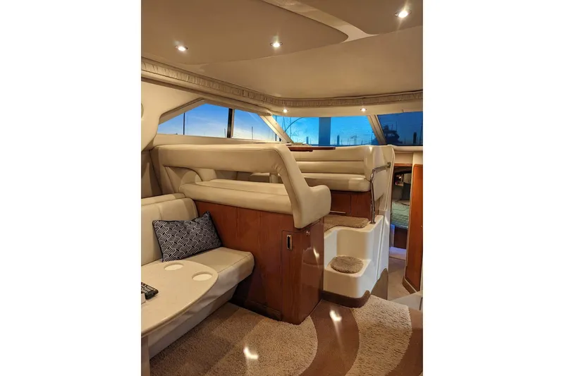 Slide: The Image of Luxurious interior of 1999 Sea Ray 400 Sedan Bridge yacht with plush seating and elegant design. - 3