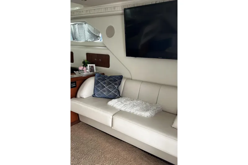 Slide: The Image of Luxurious interior of 1999 Sea Ray 400 Sedan Bridge with plush seating and modern decor. - 30