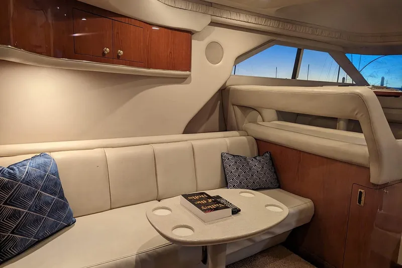 Slide: The Image of Luxurious interior of a 1999 Sea Ray 400 Sedan Bridge yacht with plush seating and elegant decor. - 4