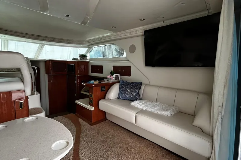 Slide: The Image of Luxurious interior of 1999 Sea Ray 400 Sedan Bridge yacht with plush seating and modern amenities. - 46