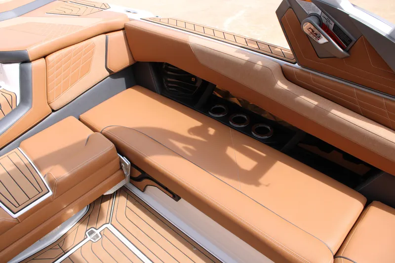 Slide: The Image of Luxurious interior of 2021 Nautique Super Air Nautique G25 with tan leather seating. - 11