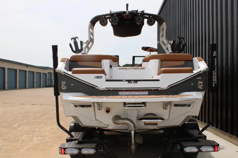 Slide: The Image of 2021 Nautique Super Air Nautique G25 boat on trailer, rear view. - 6