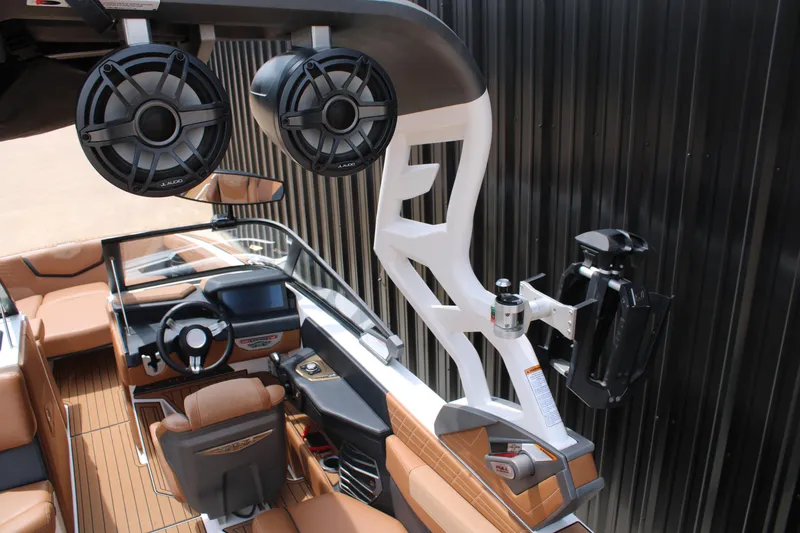 Slide: The Image of 2021 Nautique Super Air Nautique G25 interior with premium audio system and sleek design. - 9
