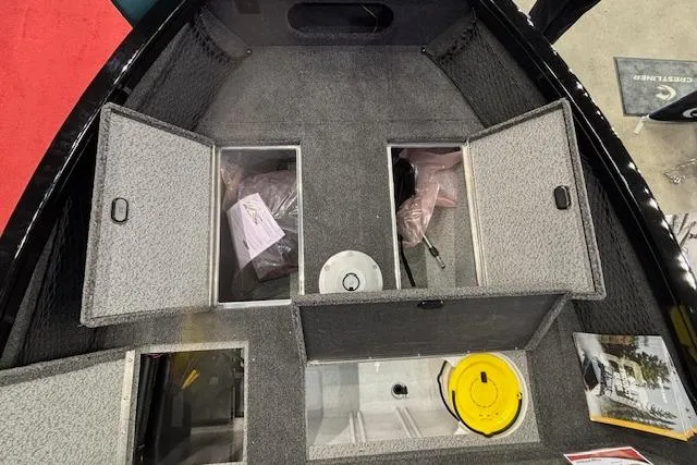 Slide: The Image of Interior view of 2026 Crestliner 1850 Kodiak WT boat storage compartments. - 10