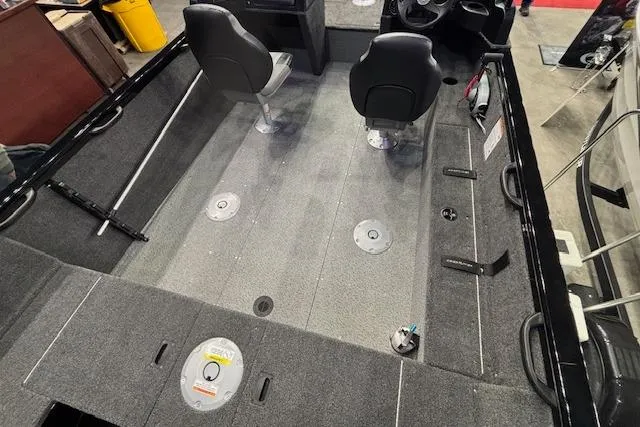 Slide: The Image of Interior view of 2026 Crestliner 1850 Kodiak WT boat, featuring seating and spacious deck. - 18