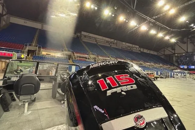 Slide: The Image of 2026 Crestliner 1850 Kodiak WT with Mercury 115 Pro engine in a large indoor venue. - 19