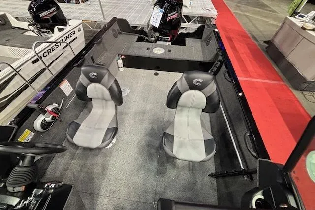 Slide: The Image of 2026 Crestliner 1850 Kodiak WT boat interior with two seats and steering console. - 8