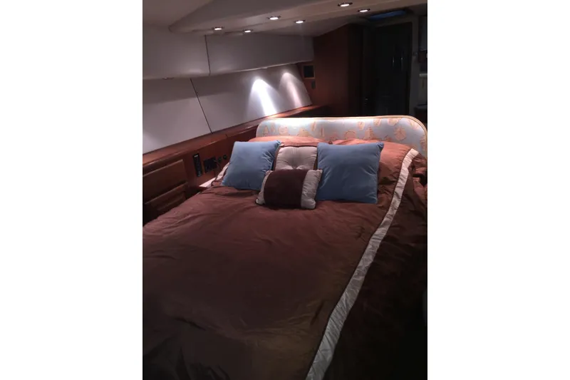 Slide: The Image of Luxurious bedroom interior of 1992 Viking 50 Convertible yacht with plush bedding. - 4