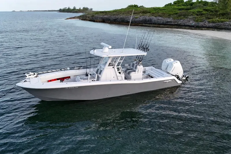 The Image of 2025 Invincible 33 Open Fisherman boat on calm coastal waters. - 0