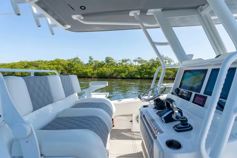 Slide: The Image of 2025 Invincible 33 Open Fisherman boat interior with modern controls and seating. - 9