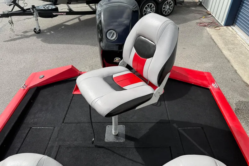 Slide: The Image of 2007 Tracker Pro Team 175 TXW boat seat with red and gray upholstery. - 13