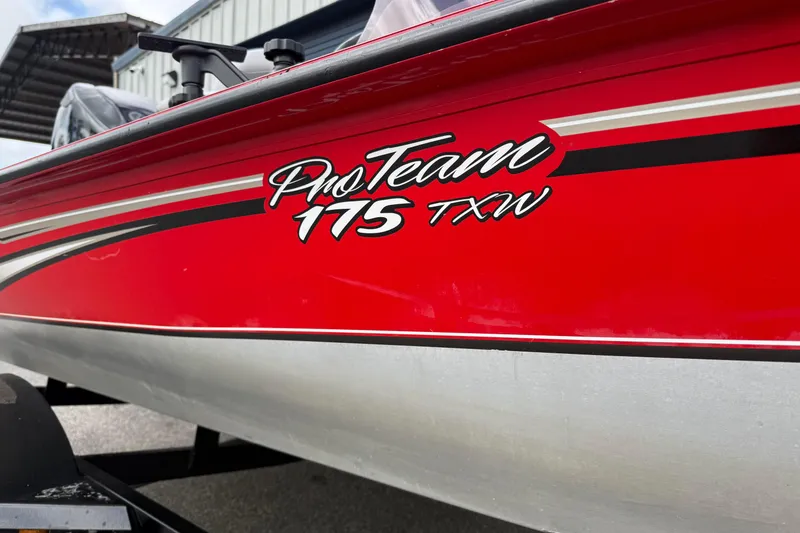 Slide: The Image of Red 2007 Tracker Pro Team 175 TXW boat with sleek design and bold lettering. - 3