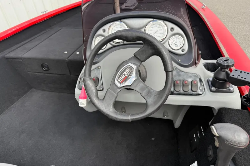 Slide: The Image of 2007 Tracker Pro Team 175 TXW boat dashboard with steering wheel and gauges. - 4