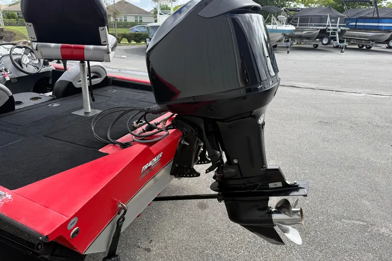 Slide: The Image of 2007 Tracker Pro Team 175 TXW boat with outboard motor, red and black design. - 6