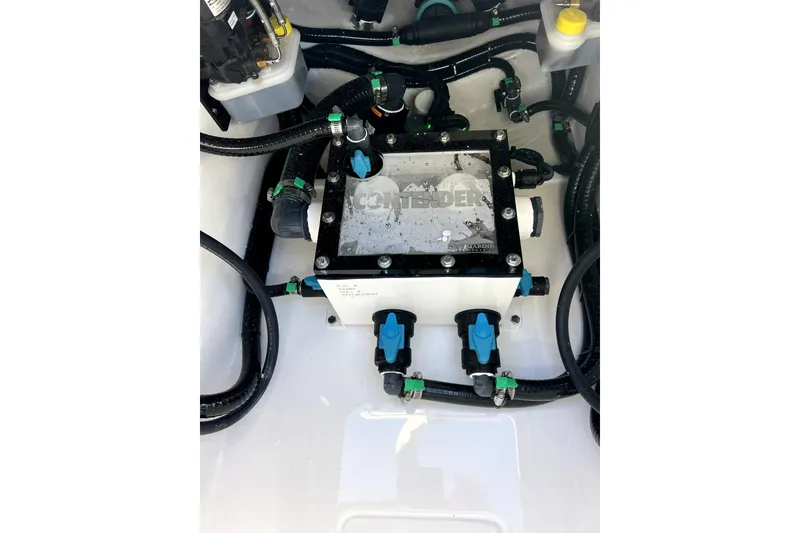 Slide: The Image of Engine compartment of 2026 Contender 32 ST boat with visible wiring and components. - 11