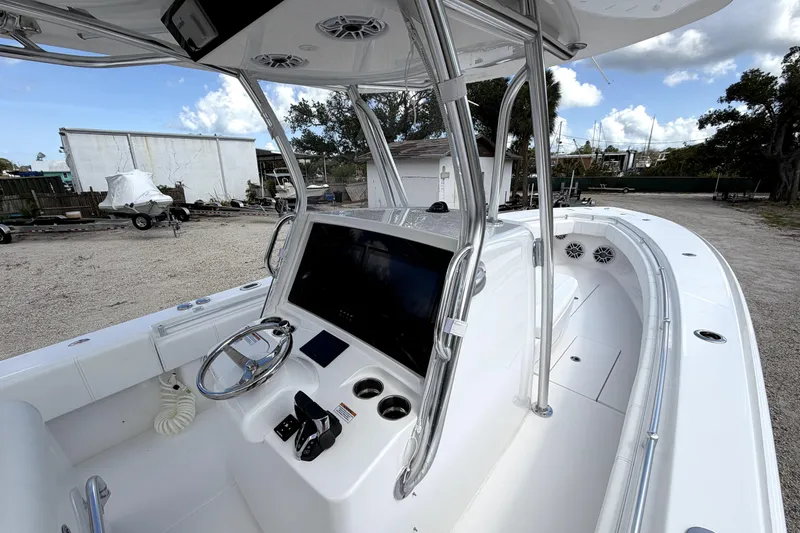 Slide: The Image of 2026 Contender 32 ST boat interior with modern helm and steering wheel. - 16