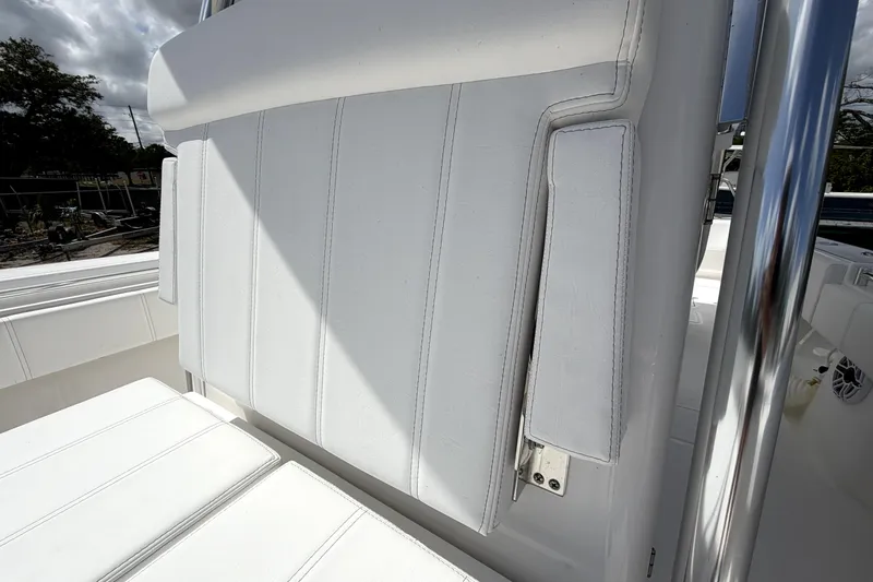 Slide: The Image of White seating on 2026 Contender 32 ST boat, featuring sleek design and stainless steel accents. - 23