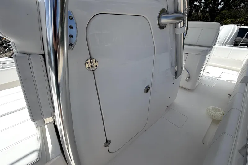 Slide: The Image of 2026 Contender 32 ST boat interior with sleek white seating and polished metal accents. - 25