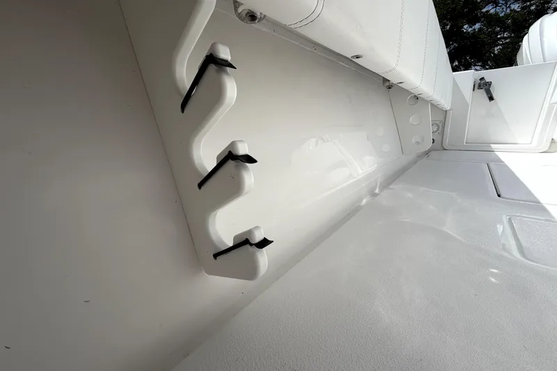 Slide: The Image of Interior view of 2026 Contender 32 ST boat, featuring rod holders and storage compartments. - 28