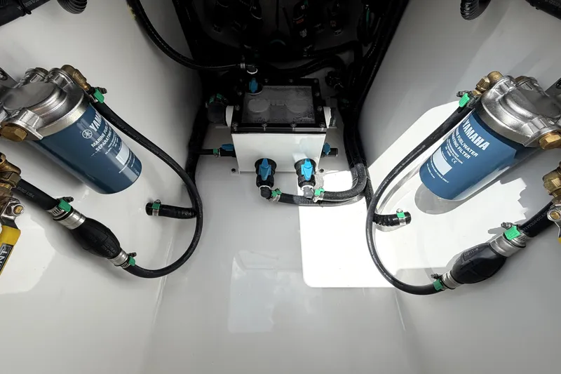 Slide: The Image of Engine compartment of 2026 Contender 32 ST with Yamaha fuel filters and hoses. - 30