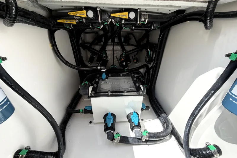 Slide: The Image of 2026 Contender 32 ST boat wiring and plumbing system in the engine compartment. - 31