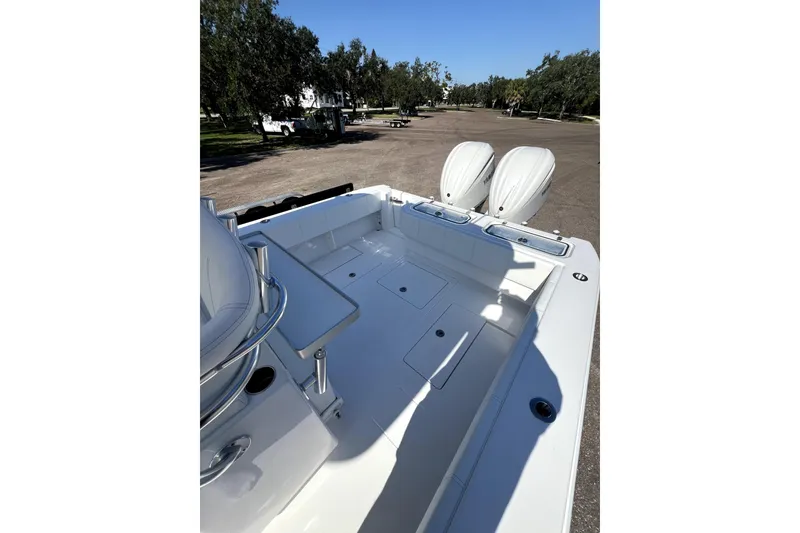 Slide: The Image of 2026 Contender 32 ST boat with dual engines, spacious deck, and sleek design. - 5