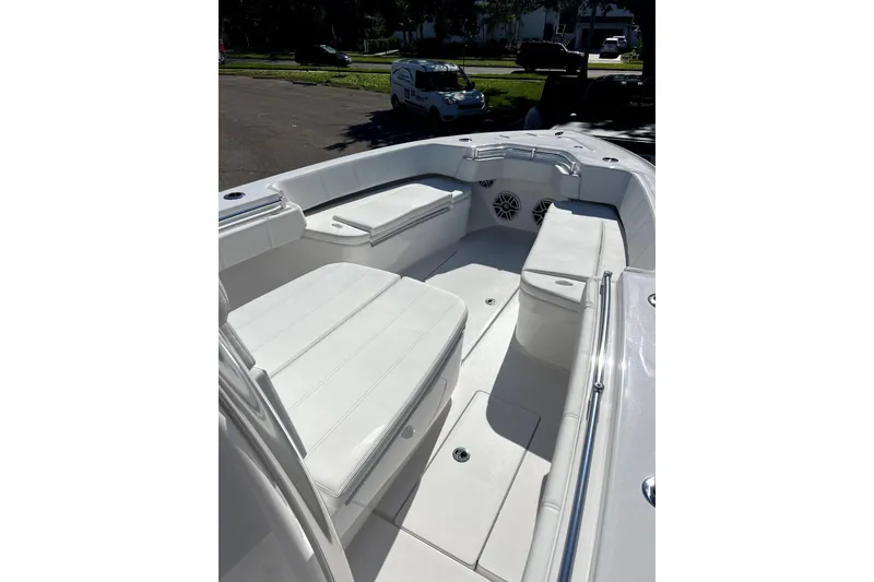 Slide: The Image of 2026 Contender 32 ST boat interior with white seating and sleek design. - 8