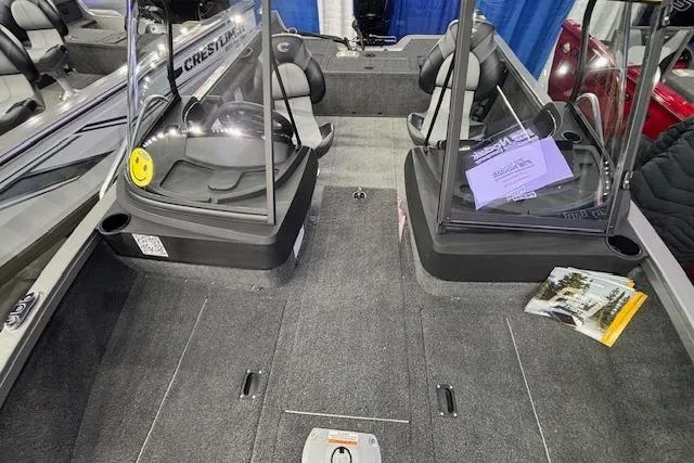 Slide: The Image of 2026 Crestliner 1650 Hawk boat interior with seating and carpeted flooring. - 11