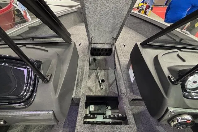 Slide: The Image of Interior view of 2026 Crestliner 1650 Hawk boat, showcasing cockpit and storage compartments. - 15