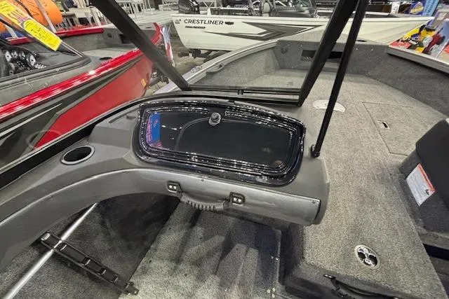 Slide: The Image of 2026 Crestliner 1650 Hawk boat interior with dashboard and seating area. - 16