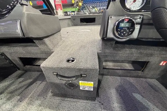 Slide: The Image of Interior view of 2026 Crestliner 1650 Hawk boat, featuring dashboard and seating area. - 17