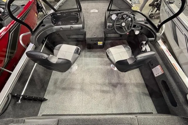 Slide: The Image of 2026 Crestliner 1650 Hawk boat interior with dual seats and steering console. - 19