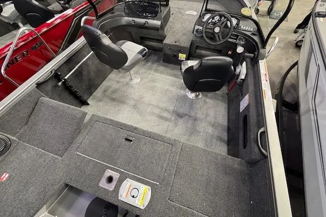 Slide: The Image of 2026 Crestliner 1650 Hawk boat interior with dual seats and steering console. - 20