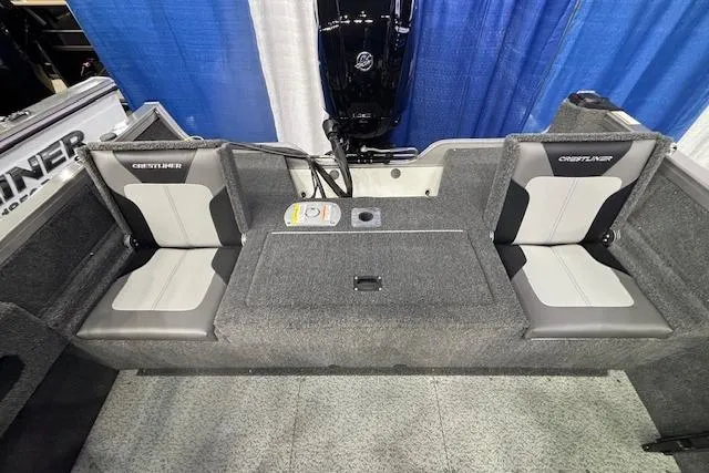 Slide: The Image of 2026 Crestliner 1650 Hawk boat interior with gray seating and storage compartments. - 7
