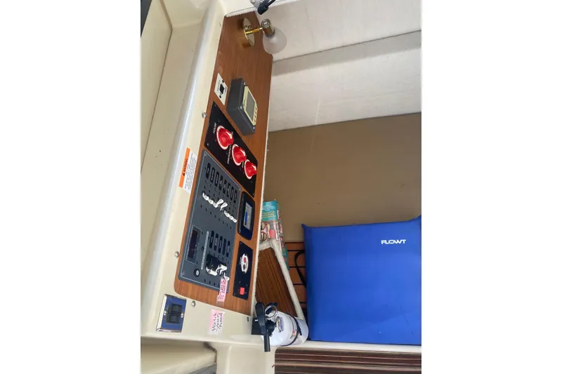 Slide: The Image of Control panel of 2020 Ranger Tugs R-23 boat with switches and safety equipment. - 7