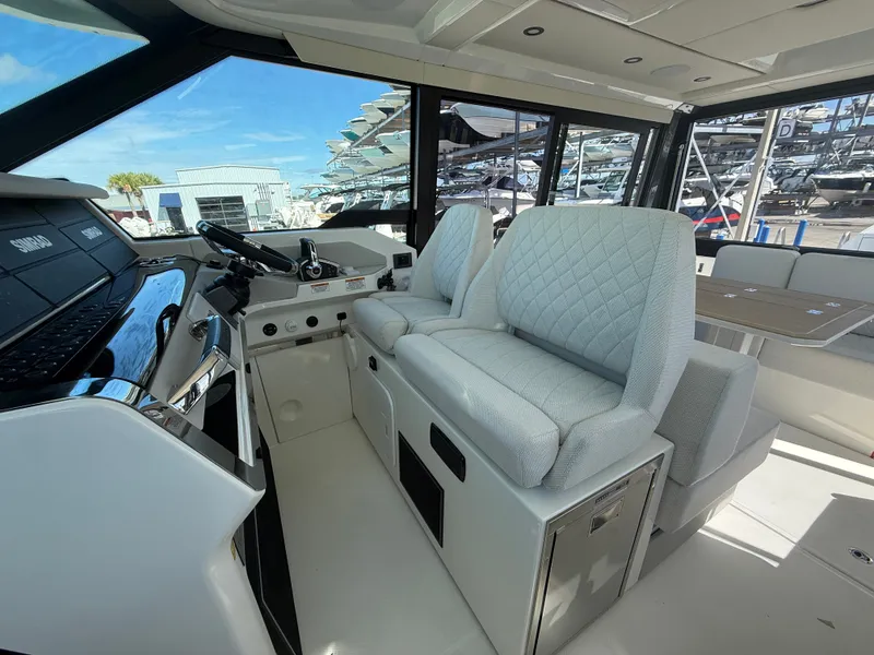 Slide: The Image of Interior of a 2027 Saxdor 400 GTC with modern seating and helm console. - 12