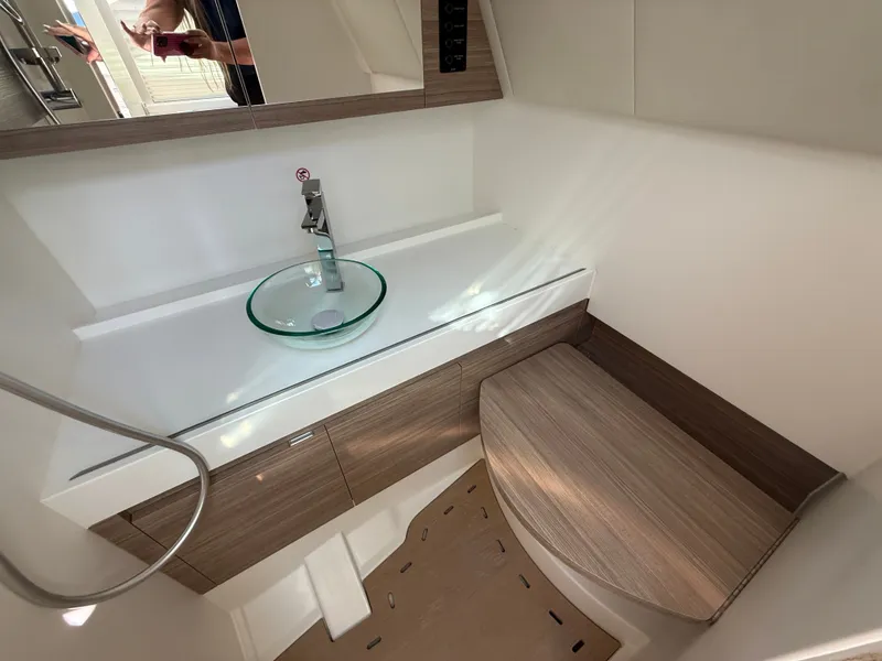 Slide: The Image of Modern bathroom with glass sink and wood accents on a boat. - 24