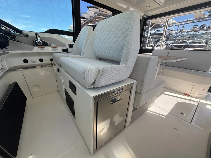 Slide: The Image of Interior of a 2027 Saxdor 400 GTC with modern seating and sleek features. - 13