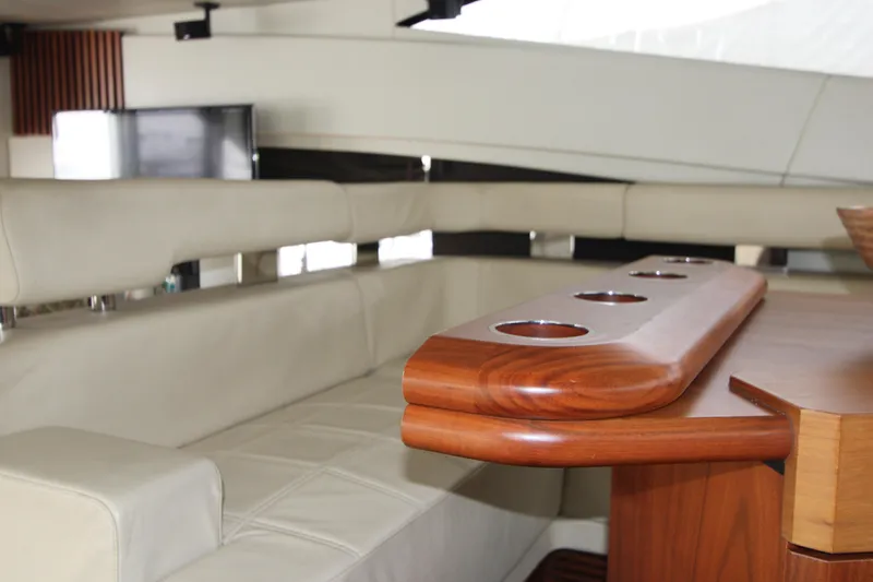 Slide: The Image of Luxurious interior of 2014 Sunseeker Manhattan 55 yacht with elegant seating and wooden table. - 10
