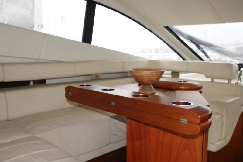 Slide: The Image of Luxurious interior of 2014 Sunseeker Manhattan 55 yacht with elegant seating and wooden table. - 11