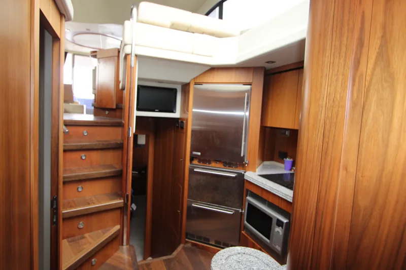 Slide: The Image of Interior of 2014 Sunseeker Manhattan 55 yacht with wooden cabinetry and modern appliances. - 21