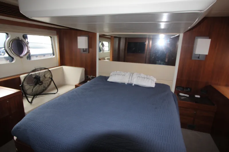 Slide: The Image of Luxurious cabin interior of 2014 Sunseeker Manhattan 55 yacht with bed and seating area. - 22