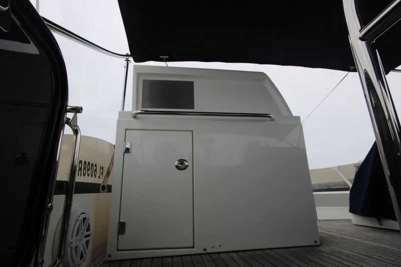 Slide: The Image of 2014 Sunseeker Manhattan 55 yacht deck with sleek white cabinetry and modern design. - 30
