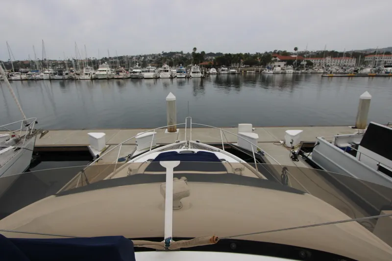Slide: The Image of Sunseeker Manhattan 55 yacht docked at marina, 2014 model, with scenic waterfront view. - 35