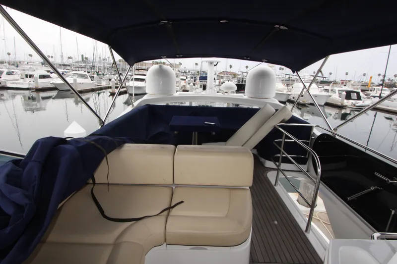 Slide: The Image of 2014 Sunseeker Manhattan 55 yacht interior with seating, docked at marina. - 36
