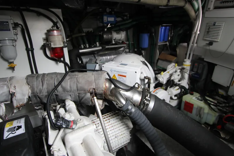 Slide: The Image of Engine room of a 2014 Sunseeker Manhattan 55 yacht, showcasing mechanical components and systems. - 40