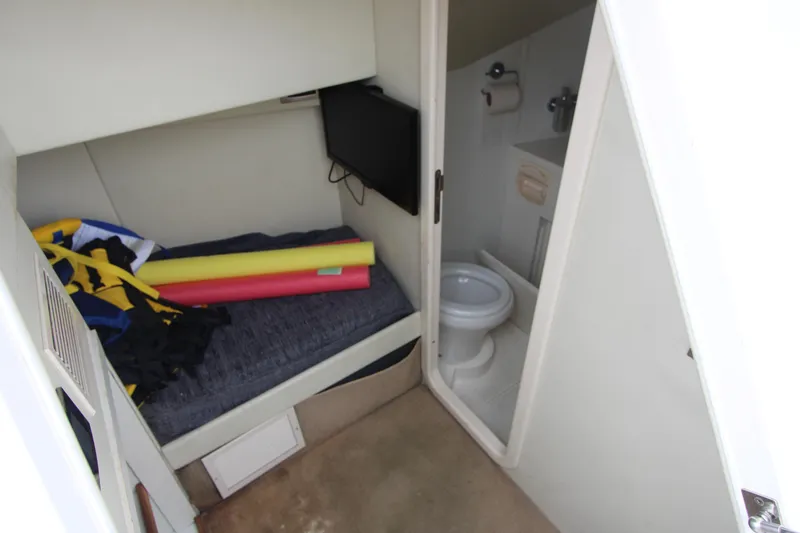 Slide: The Image of Compact cabin interior of 2014 Sunseeker Manhattan 55 yacht with bed and bathroom. - 45